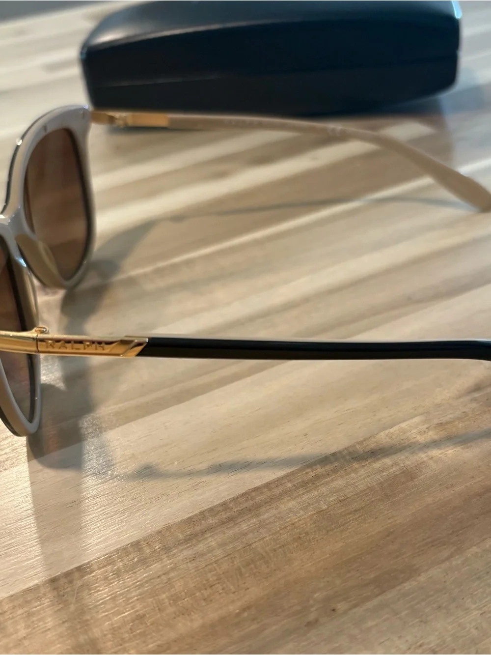 Ralph Lauren Black Sunglasses with Subtle Gold Accents
